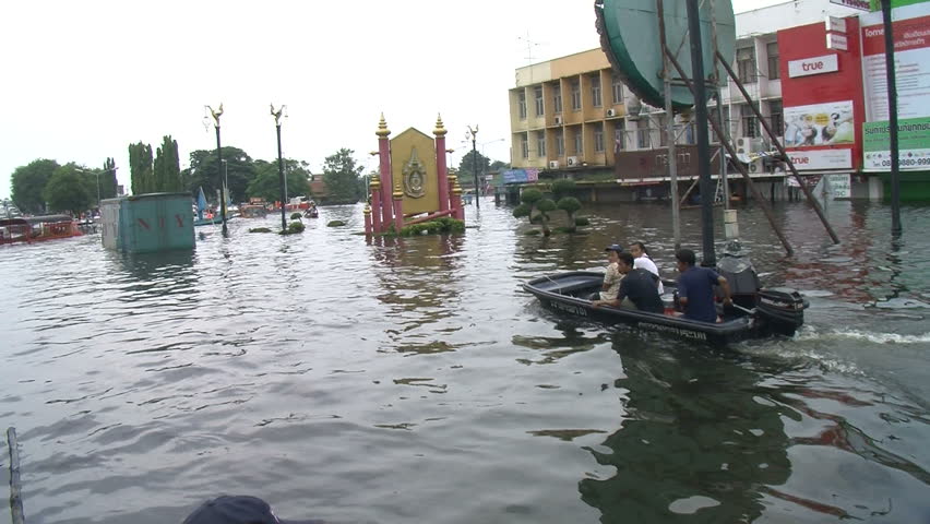 AYUTTHAYA, THAILAND - OCTOBER 12: Floods inundate city residents on October 12, 2011, Ayutthaya, Thailand. Parts of Thailand are now experiencing the worst floods in half a century, as water inundates villages, historic temples, farms, and factories.