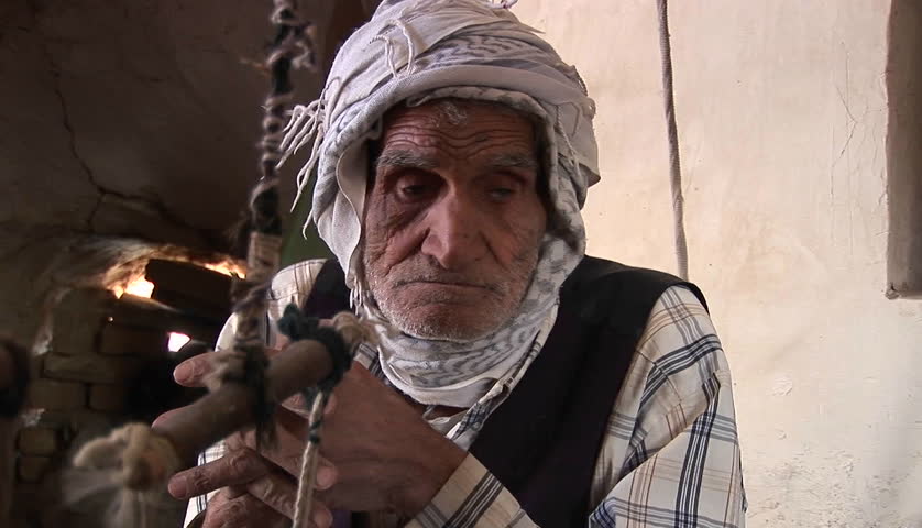 IRAN - CIRCA 2010: An elderly man wearing a keffiyah speaks circa 2010 in Iran.