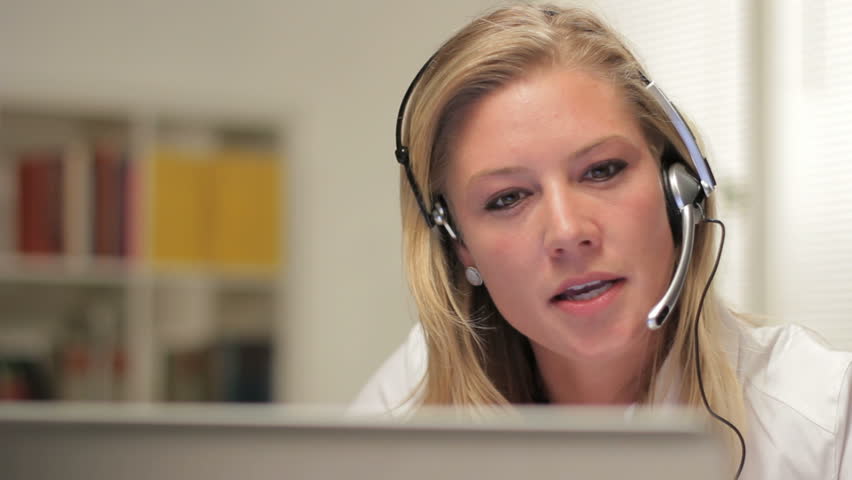 Female telephone customer service operator, happy
