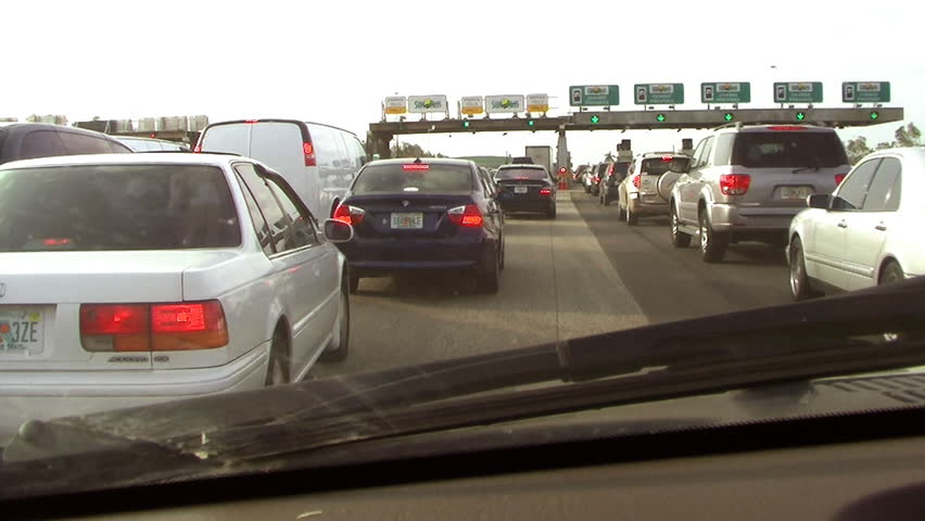 MIAMI, FLORIDA - CIRCA 2009: Traffic jam view from a car mirror in Florida's turnpike extension.