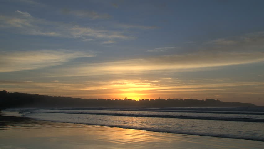 sunrise surfers on the beach