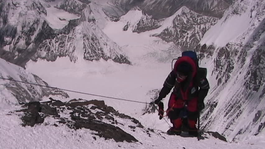 In the death zone climbing towards the summit of Everest - Climbers navigate difficult terrain