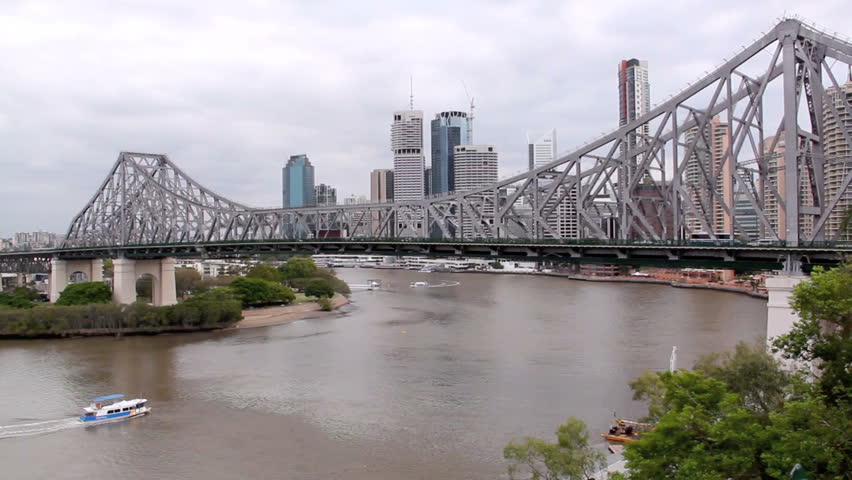The Story Bridge spanning the Brisbane River in Brisbane with a ferry. 