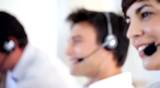 Closeup of attractive call center representative on call giving service