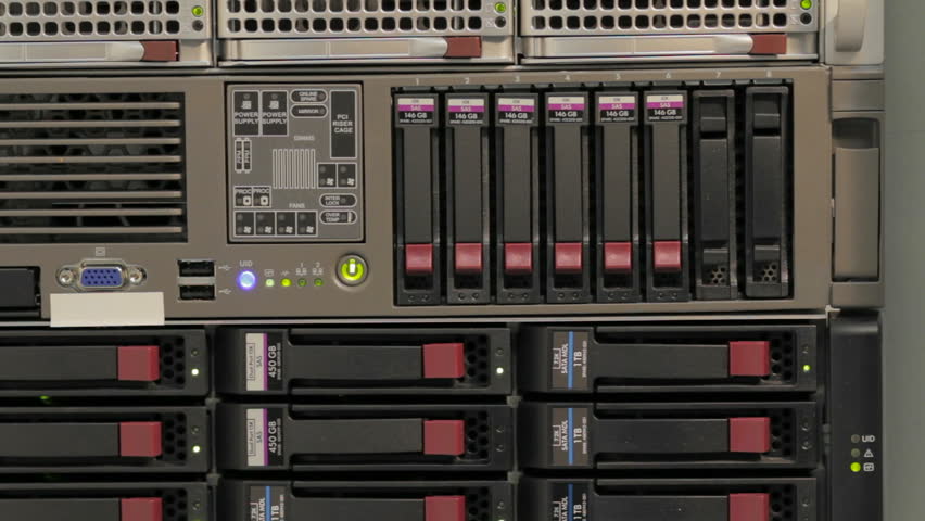 Blinking LEDs of server stack with hard drives in a datacenter