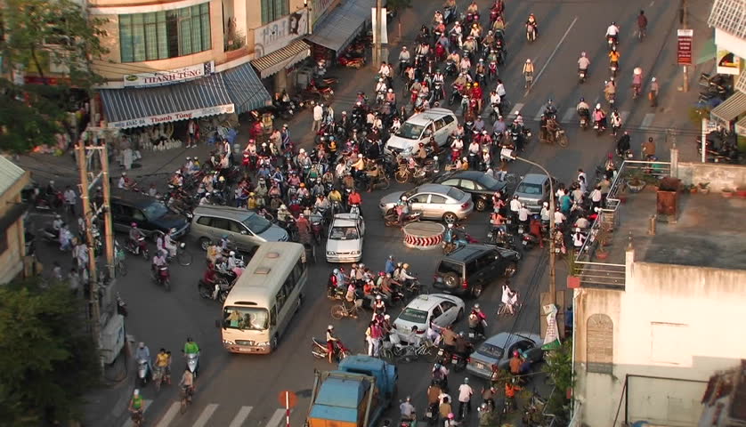 CHINA - CIRCA 2010: Pedestrian and motor traffic at a busy three-way intersection.