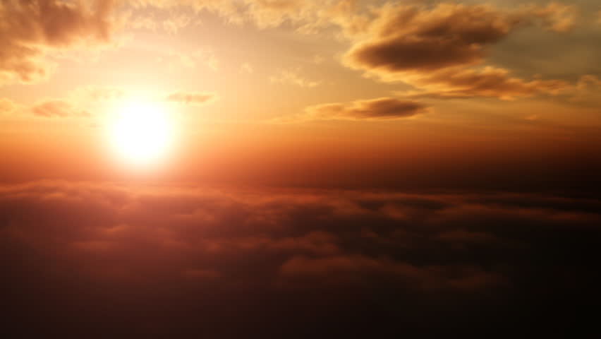 Aerial pan shot over clouds during beautiful sunset 