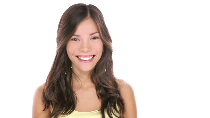 Woman on white background looking to side negative, then looking to side positive. Happy smiling beautiful young mixed race Asian / Caucasian female model.