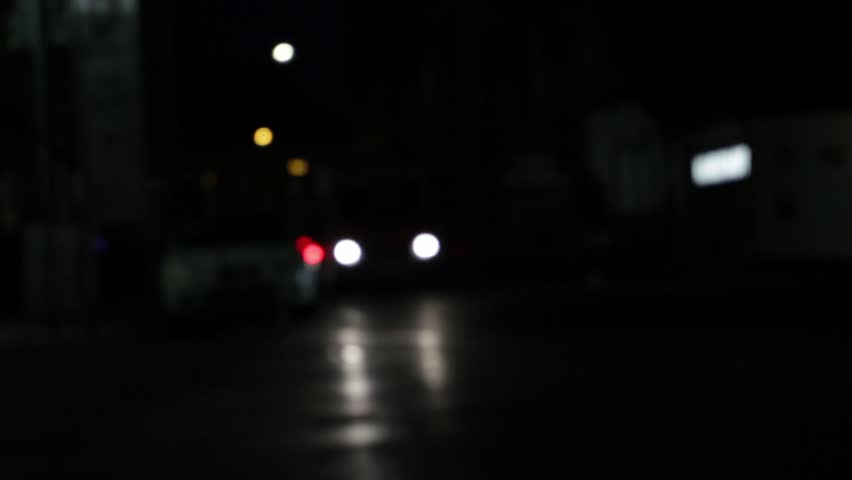 Ambulance with flashing blue lights, de-focused