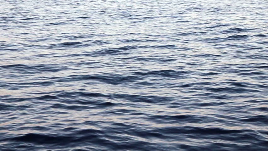 Sparkling water ripples on the red sea.