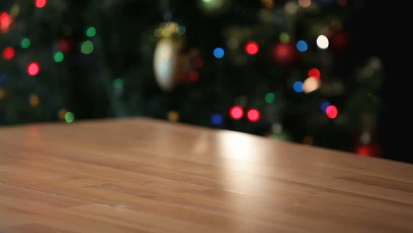 Santa putting a giftbox on the table