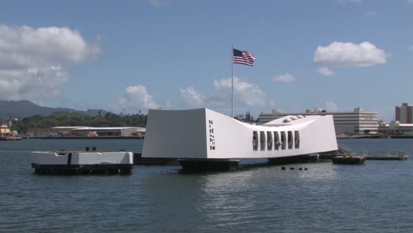 HONOLULU FEB 21: Spectators visit Memorial in Pearl Harbor, Honolulu Hi. USS Arizona battleship Memorial. Pearl harbor, Hawaii. White memorial building floating on top of wreck of battleship. 