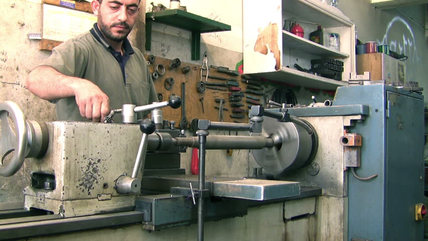 AMMAN, JORDAN -  JUNE 8: An unidentified machine operator on June 8, 2011 in Amman, Jordan. The value of the industrial exports for year 2005 in Jordan was about (2379) million; Industrial exports contribute about 93.5% of the national exports.