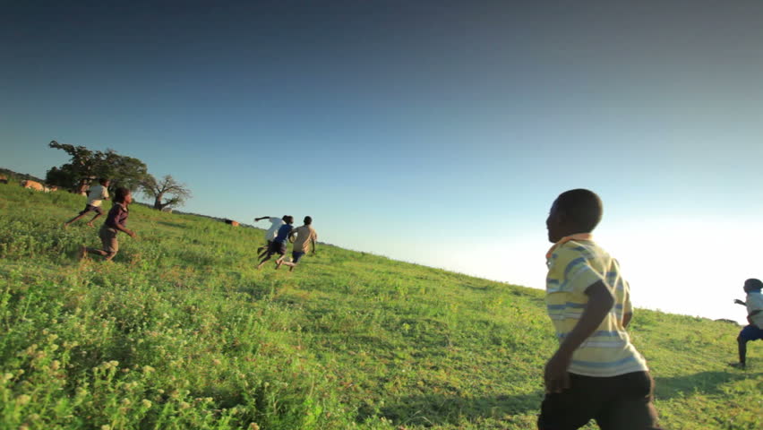 KENYA, AFRICA - CIRCA AUGUST 2010: Children playing soccer on the fields in Kenya, Africa circa August 2010.