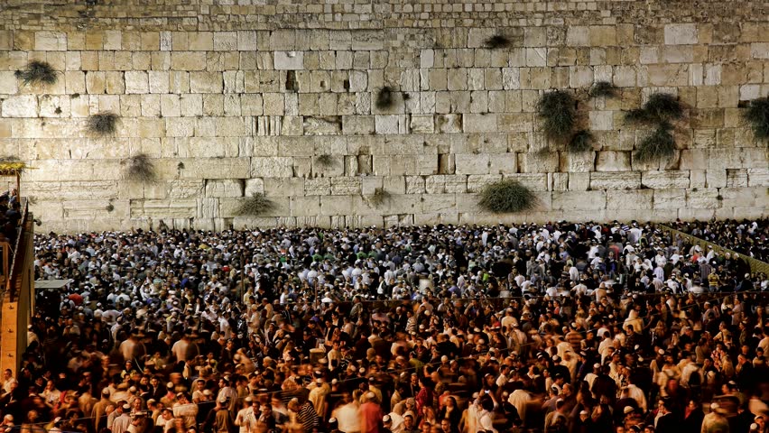 JERUSALEM, ISRAEL - OCT 6, 2011: Timelapse of the Western Wall as Orthodox Jews pray around midnight on October 6, 2011 in Jerusalem.
 
