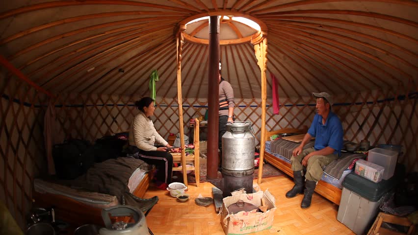 MONGOLIA - JULY 17, 2009: Locals cook a stone stew inside their nice rounded hut on July 17, 2009 in Mongolia.