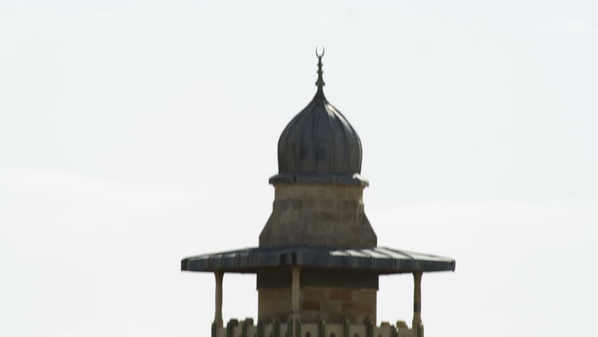 Tilt down a minaret in Jerusalem, Israel.  There is a second minaret in the background at the end of the move.  02/26/2011