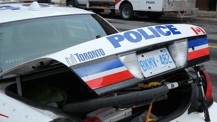 TORONTO, ONTARIO - NOV 23th: Police vehicles at the Occupy Toronto site on Nov 23rd, 2011, Toronto, Ontario, Canada. The site was closed down on Nov 23rd following a superior court judge ruling.
