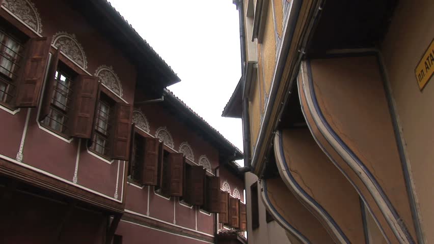 2 people walking down an old street of Plovdiv