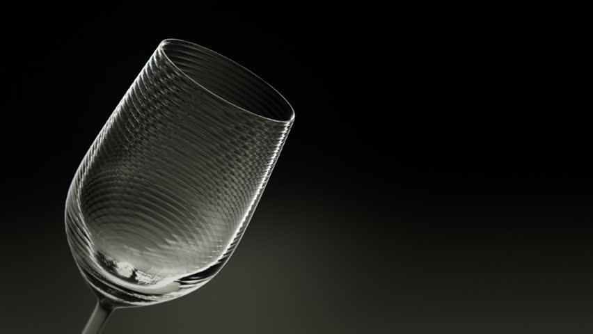 Red Wine being poured into an elegant crystal glass.
