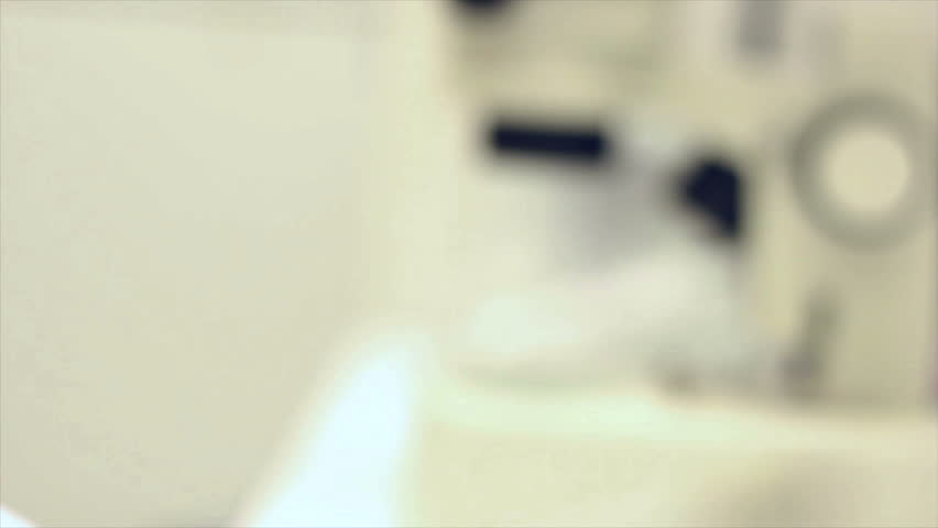 HD clip of streaking out a bacterial colony on a petri dish