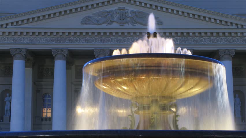Fountain  in front of theater Bolshoi is shone in night lamps in evening, time lapse