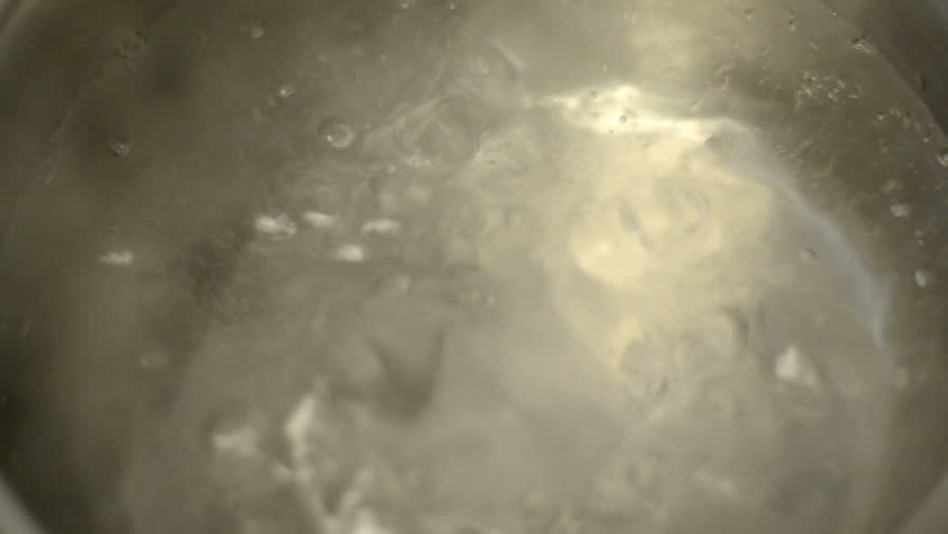 Water boiling in a saucepan.