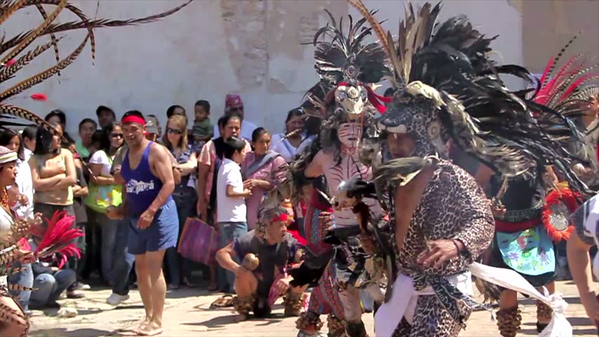 IXCATEOPAN, MEXICO - CIRCA FEBRUARY 2011: Indigenous dancer dances on the grave of the last Aztec Emperor Cuaotemhoc circa February 2011 in Ixcateopan, Mexico 
