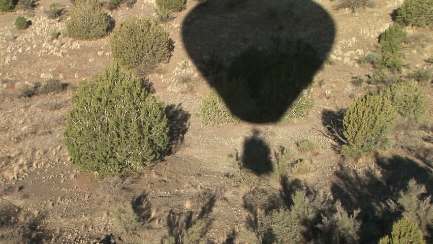 Hot Air Balloon Shadow floating across the Sedona, Arizona landscape