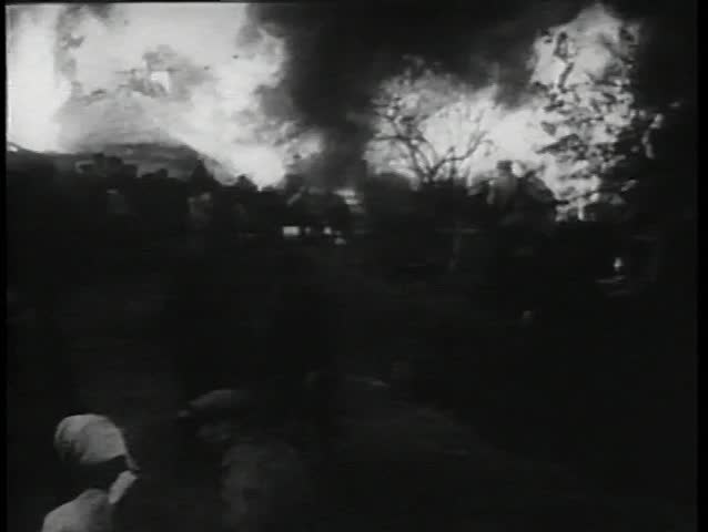 Peasants fleeing burning village
