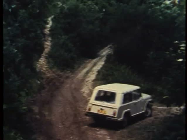 Car driving on narrow mountain road in Spain