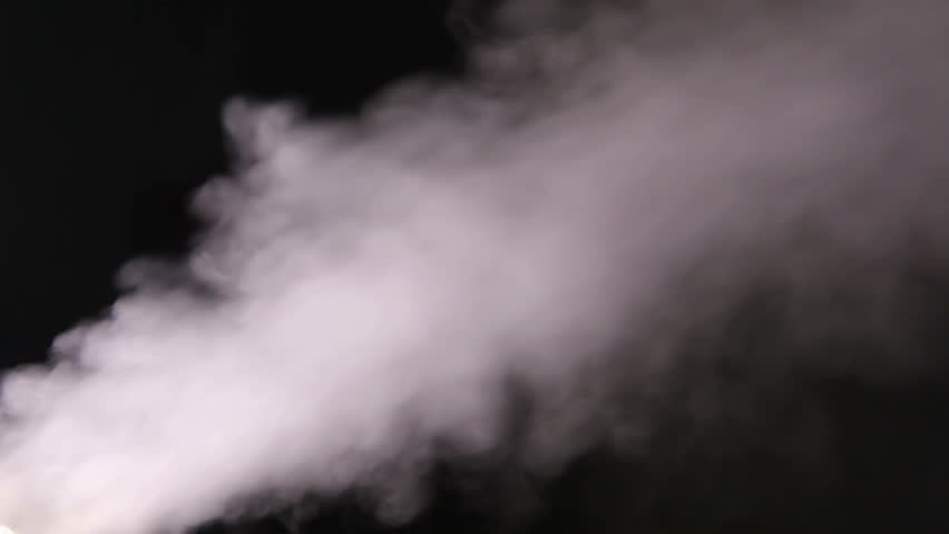 Humidifier emits smoky vapors in dark room at night