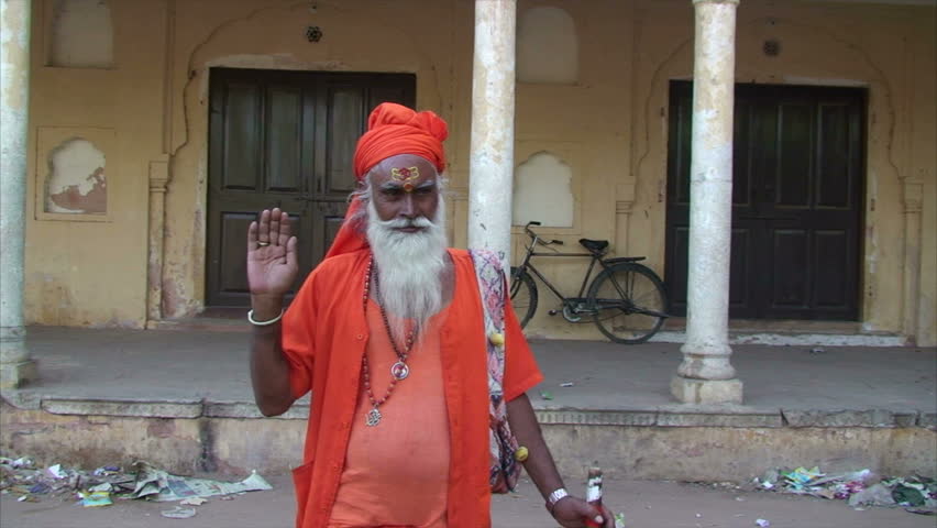 JAIPUR, RAJASTHAN, INDIA - MAY 14: Indian Sadhu or holy man raising his arm in blessing in Jaipur, India on May 14, 2011. There are 45 million sadhus in India today and they are widely respected for their holiness.