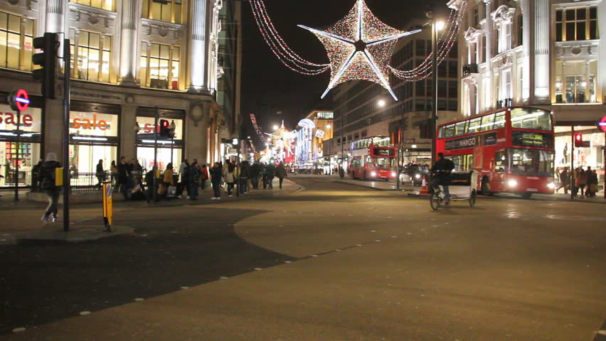 LONDON, UK - DECEMBER 27: Busses and other traffic drive beneath Christmas lights on Oxford Street on December 27, 2011 in London, UK. Oxford Street is one of the main shopping streets of London.