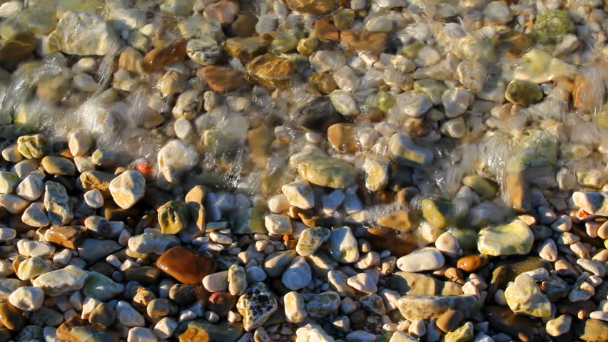 Rocks under seawater at morning sunlight