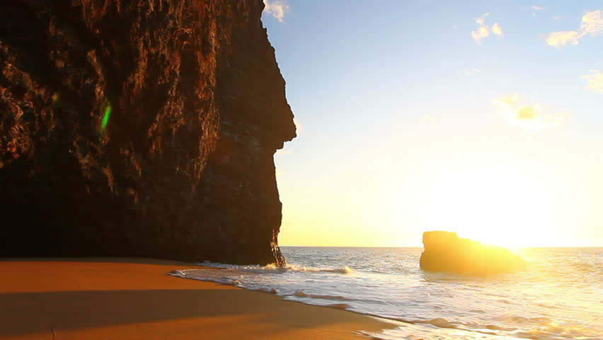 Ocean Waves Crashing On Tropical Beach at Sunset