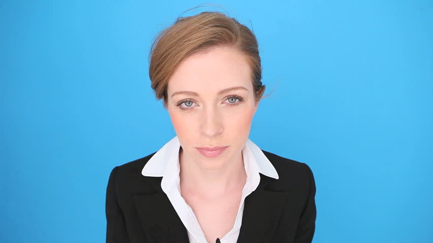 Nerd businesswoman wearing a pair of heavy framed oversized glasses with a prim expression.