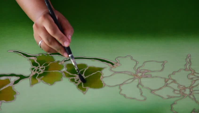 Coloring the batik fashion fabric with floral motif