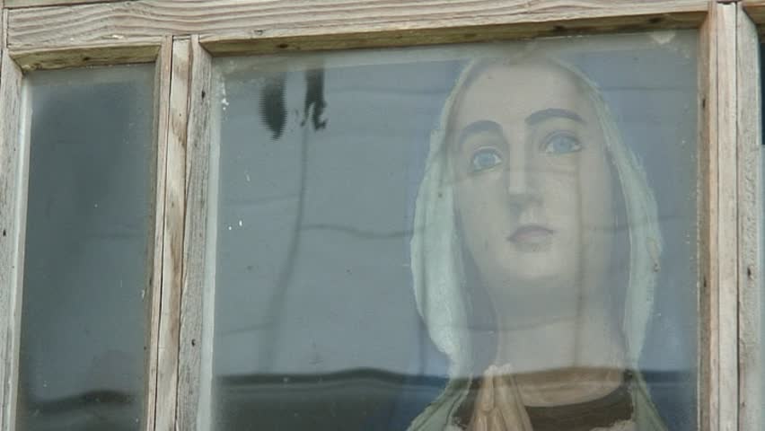 vintage wooden figure of virgin Mary under the glass