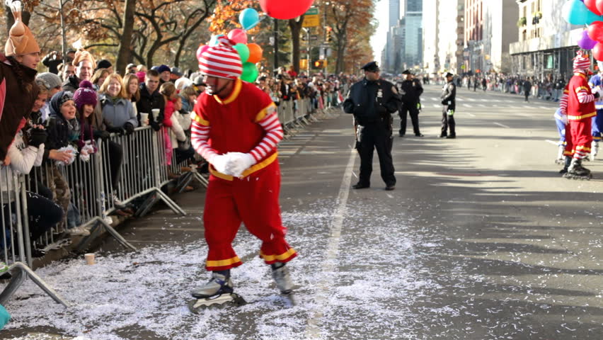 NEW YORK CITY, NY - NOVEMBER 24: Clown Rollerblader with crowd during Macy's Thanksgiving Day Parade on November 24, 2011 in New York City, New York. 