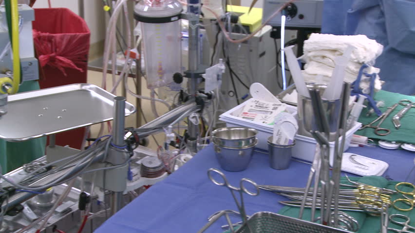 Pan left to right of surgical instruments during surgery