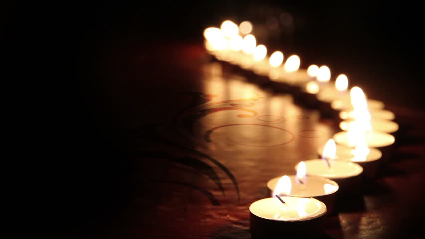 little candles lined up light up one by one