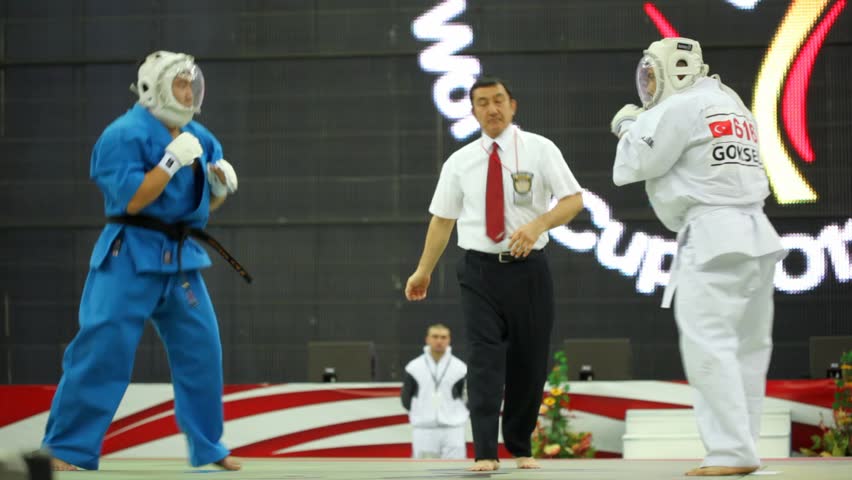 MOSCOW - FEBRUARY 19: Judge separates sportsmans Goksel from Turkey and his opponent fighting at World Cup 2011 KUDO in Olympiysky Sports Complex on February 19, 2011 in Moscow, Russia.