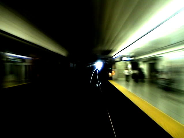 Timelapse shot from the front of a subway car. 