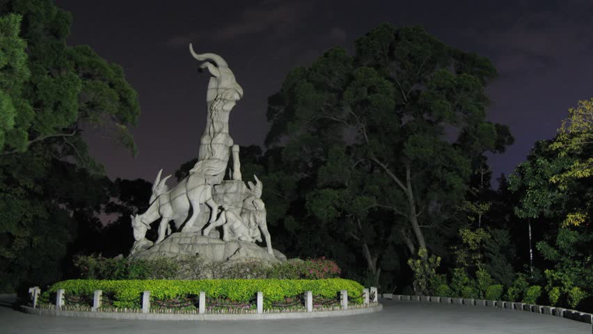 Tourists photograph Sculpture of Five Rams in evening, City main character Guangzhou , on Nov 24, 2011 in Guangzhou, Guangdong, China 