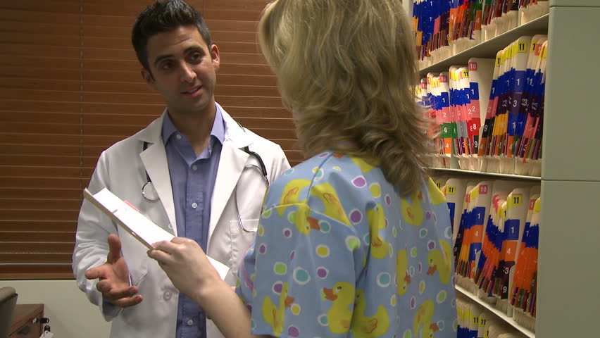 Doctor and nurse in filing room