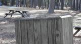 Plastic Food Carton Pitched Into Wooden Trash Can