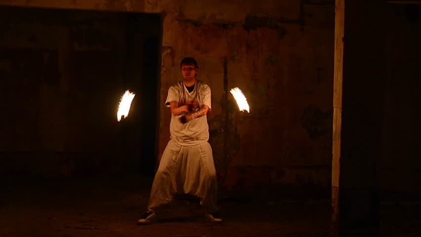 man with burning lamps