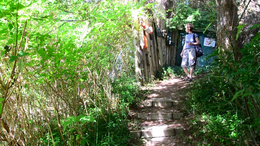 Middle age woman on trail at summer day in Vancouver, Canada.