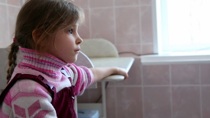 Little girl sit at surgery, doctor comes and makes injection